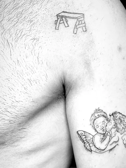 A collection of smaller tattoos that are part of a larger, ongoing sleeve project. Each small piece adds to the overall story.