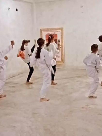 A student executes a clean side kick (yoko geri). We focus on height, power, and retracting the kick quickly.