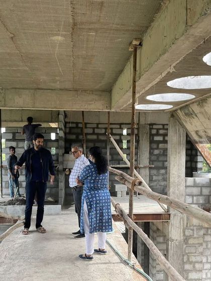 We believe in experiencing the construction process with our clients. Here we are on a site visit, walking across a temporary bridge and discussing the progress and feeling of the emerging spaces.