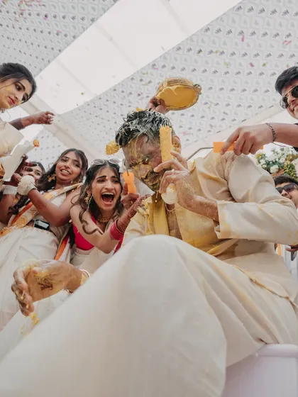 The groom's Haldi ceremony, where friends and family don't hold back! I plan for these high-energy moments, ensuring the photography team is ready to capture all the action.