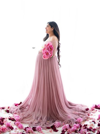 This portrait combines a flowing gown with scattered petals on the floor. I'll teach you these simple but effective techniques to add a touch of romance and color to your images.