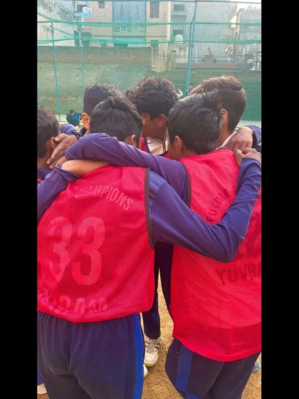 A team huddle before the game. This is where strategies are made and the fighting spirit is ignited.
