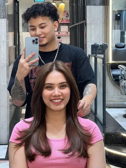 Happiness is a new haircut. This client is glowing after getting a fresh butterfly haircut, which adds soft, flattering layers.