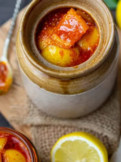 A close-up of our tangy and spicy Nimbu ka Achaar. You can see the rich texture and the perfect blend of spices that my mom uses. This is the perfect pickle to aid digestion and add a kick to any meal.