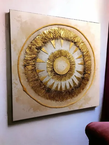 This 3D embossed canvas painting features a striking abstract sunburst design. The layers of golden foil and rope create a visually dynamic and textured effect, making the 32x32 inch artwork appear lifelike.