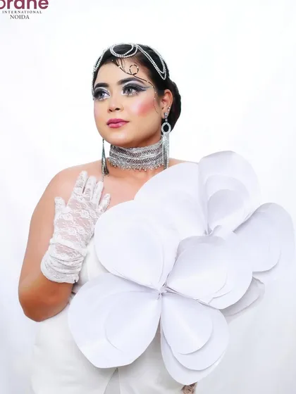 A full-body shot that shows how the all-white theme is carried through the entire look for a powerful statement.