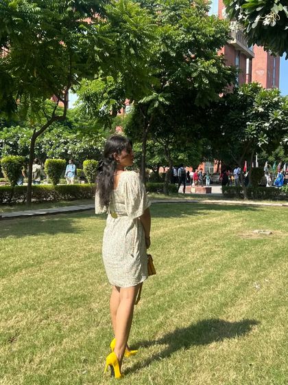 A back view of the floral dress, showing its flattering fit and cute flutter sleeves. This is an easy, one-and-done outfit for warm days.