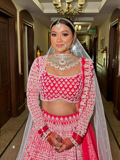 A full-length shot of Rubina, looking like a true goddess in her red lehenga.