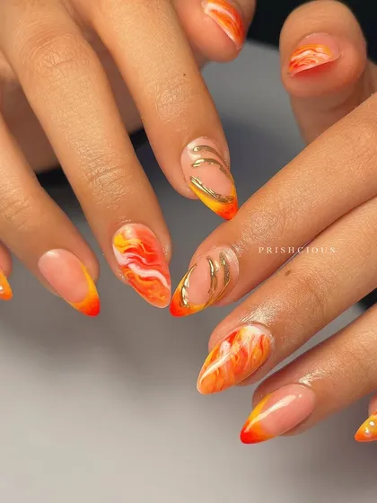 The full view of this stunning orange marble manicure. The colors are so vibrant and perfect for summer.
