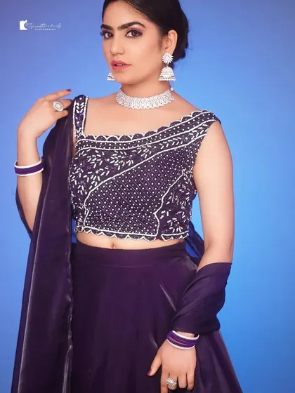 Sometimes, a simple, clean background is all you need. My studio is equipped with solid color backdrops like this vibrant blue, perfect for creating striking portraits and model portfolio images where the focus is all on you.