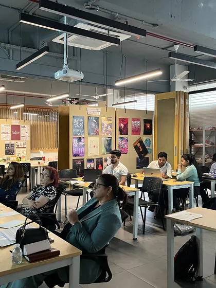 The jury panel, including our co-founder, listening intently to a student's presentation. We are committed to engaging with and contributing to the design community.