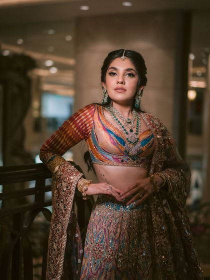 This image showcases the full garba look, with a colorful lehenga and statement jewellery. I teach how to balance all these elements for a cohesive look.