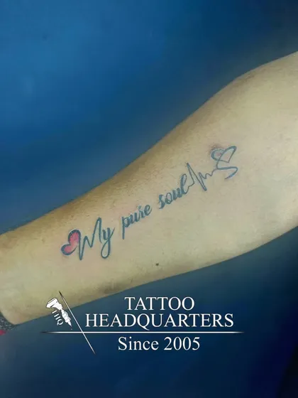 A "My pure soul" script tattoo with hearts and a heartbeat line, symbolizing a life lived with purity and love.