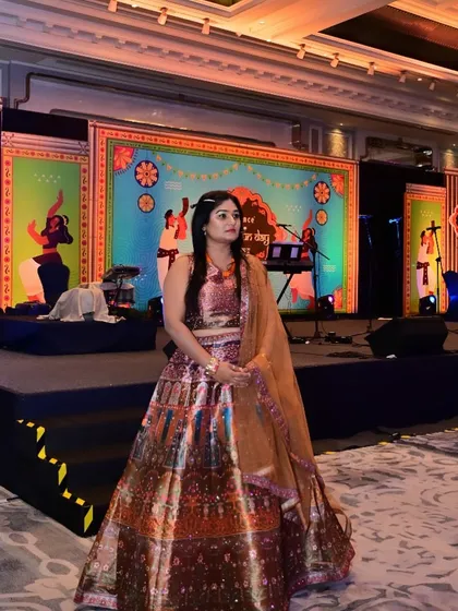 My 'can't start the show until I get my chai' face, captured in a beautiful traditional lehenga.