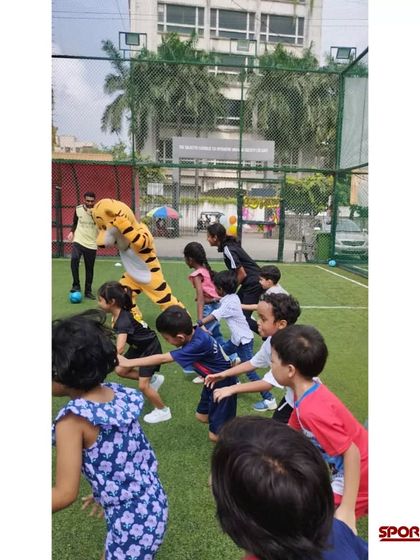 A group of kids enjoying a football-themed birthday party I organized. I create a fun and safe environment for children to celebrate their special day with their friends on the field.