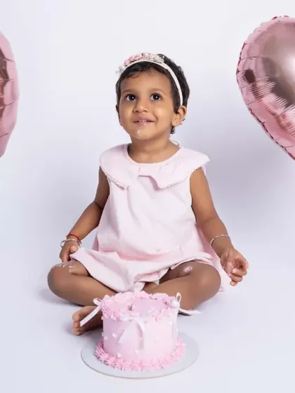 Let's celebrate with a cake smash! This little princess is turning two, and we marked the milestone with a fun, messy, and absolutely adorable cake smash session. These shoots are all about capturing pure, uninhibited joy.