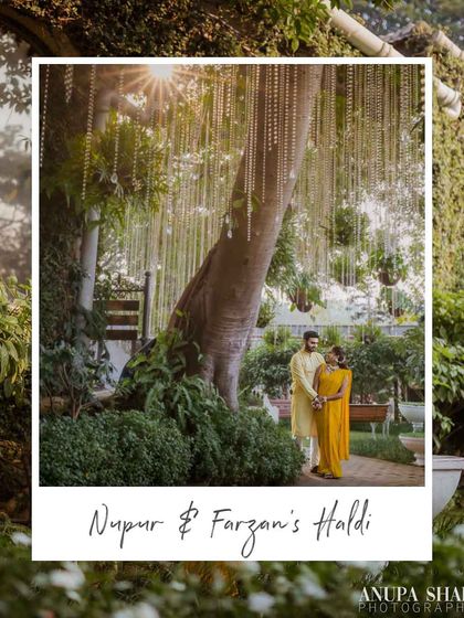 A serene moment during the Haldi festivities. We used the natural beauty of the venue, accenting a large tree with hanging crystal strings to add a touch of magic.