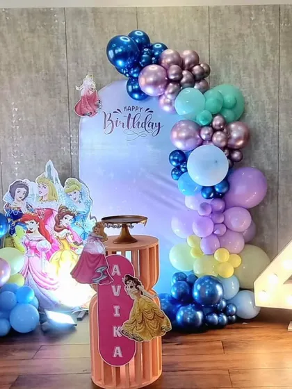 A charming Disney Princess themed birthday party with a modern balloon garland in metallic and pastel colors.