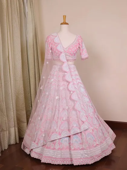 A perfect pink beauty for a modern bridal look. This mannequin shot shows the full lehenga with its unique scalloped dupatta.
