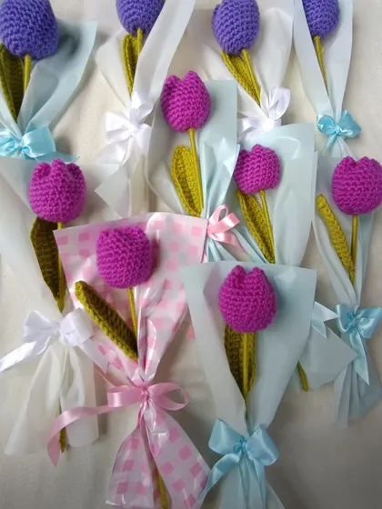 Individually wrapped purple and magenta tulips.