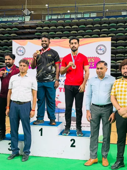 Our coach Akash Gupta on the podium after securing the runner-up position in the Men’s Singles at the All India Civil Services Table Tennis Tournament 2024-25.