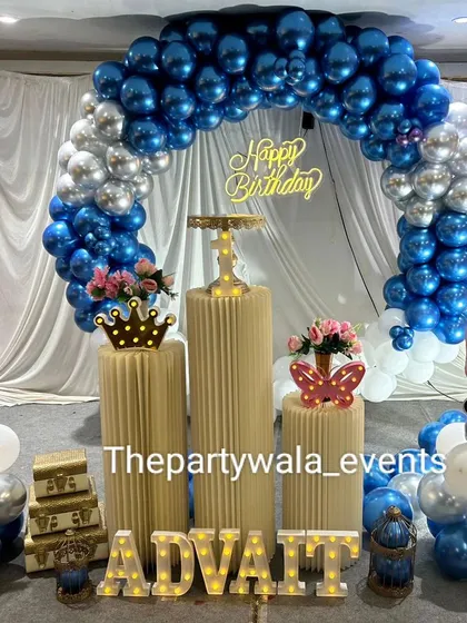 A beautiful Boss Baby setup with shiny blue and silver chrome balloons. The light-up name and character cutouts complete this stylish party look.