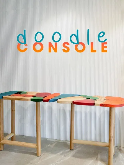 The "Doodle Console" is a perfect example of how we turn a client's inspiration into a functional piece of art. Based on a brief for something bright and colorful, we designed this interlocking console with a playful, puzzle like form and a vibrant color palette.