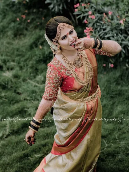 A playful, candid moment captured beautifully. The bride's makeup remains flawless even in natural outdoor lighting, highlighting the radiant and fresh look I aim for.