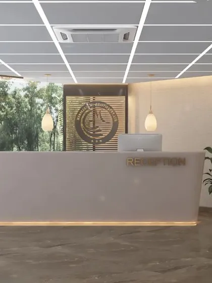 The main reception area for the 9,000 sq. ft. Mahalakshmi Logistics office. We designed a clean, expansive entrance with a minimalist reception desk, subtle cove lighting, and large glass walls to create a welcoming and professional first impression.