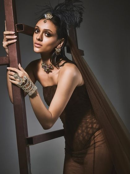 A full-length shot from the Reasons Jewellery campaign, using a ladder as a prop to create interesting lines and a dynamic pose.