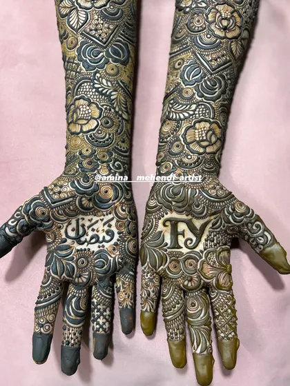This design features the initials 'F' and 'Y' on one palm and the name 'Faizan' in Arabic script on the other.