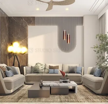 In this DLF, Gurgaon drawing room, I used a nature-inspired metal wall sculpture and a unique floor lamp to create an artistic and organic feel. The curved sofas soften the space, making it feel inviting.