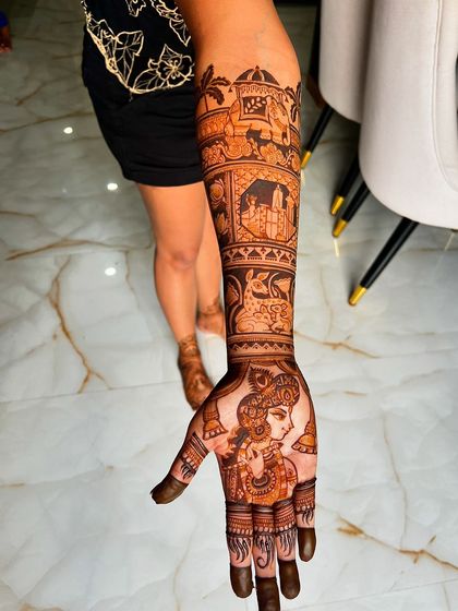 A detailed view of the left arm, featuring the Krishna portrait and the San Francisco skyline. This demonstrates how I balance intricate figures with detailed background elements.