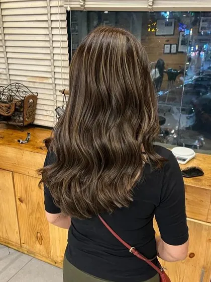Another view of the blonde balayage, showing how the light reflects off the different tones, creating a beautiful, shimmering effect.
