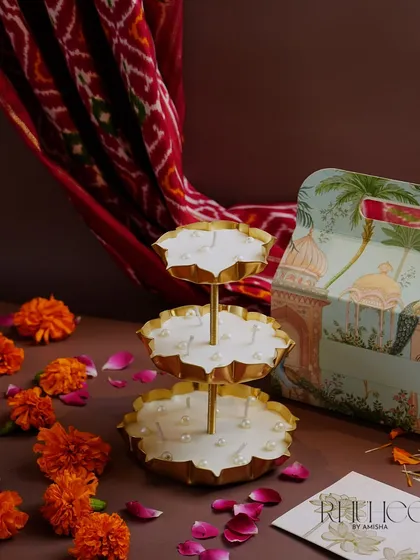 Our Stand Urli Candle is a centerpiece that lights up your puja space like a living rangoli. The three-tiered design creates an inviting aura for Lakshmi-Ganesh puja or any festive celebration.