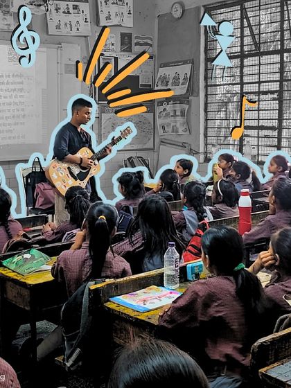 An instructor plays guitar for a class of girls, who are all completely focused on the music. This image captures the quiet power of music to command attention and inspire awe.