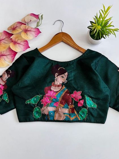 The same printed pure silk blouse in a beautiful bottle green color.