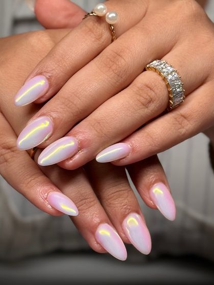 This is what I call opal chrome. The finish on these almond nails shifts between pink, yellow, and lavender, mimicking the fire of a real opal stone.