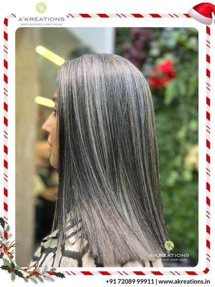 A sleek and modern take on highlights. The straight styling showcases the precise placement of these cool-toned streaks for a chic, polished finish.