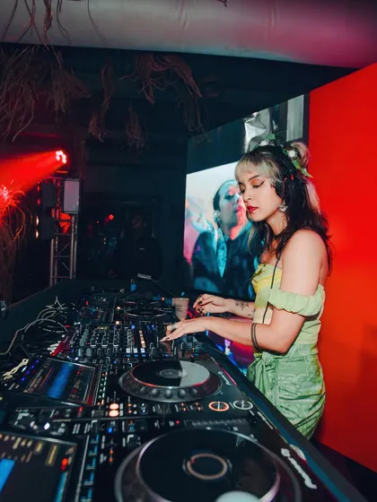 In the zone, mixing tracks at a club. I love the challenge of blending different genres to create a seamless musical journey.