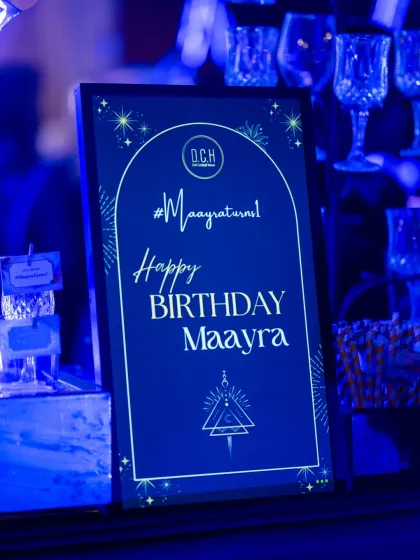 A personalized welcome sign for the birthday girl's party, a small detail that adds a special touch.