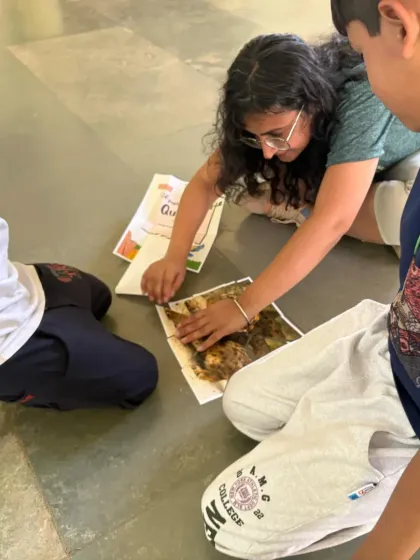 Kids working together on a nature puzzle during our Mother's Day forest trail. Our walks include fun, educational activities to keep everyone engaged.