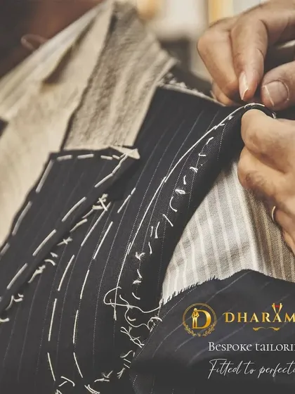Craftsmanship is at the heart of what I do. This image shows the intricate process of hand-stitching a bespoke suit jacket, a detail that ensures a perfect fit and finish. This is the legacy of tailoring passed down in my family.