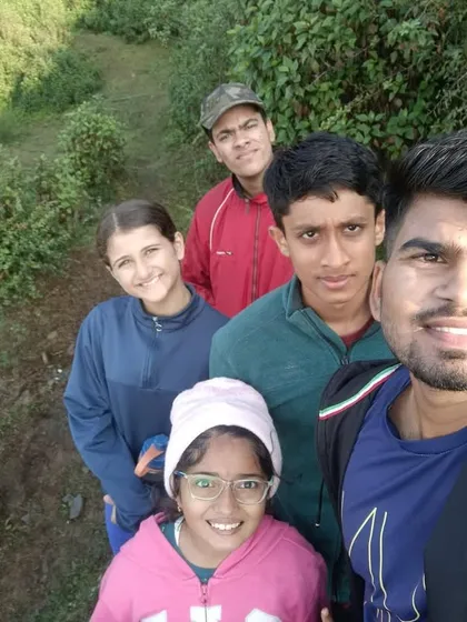 A selfie with the coach during a trek. Our coaches are mentors who guide and support our athletes through every step of their journey.