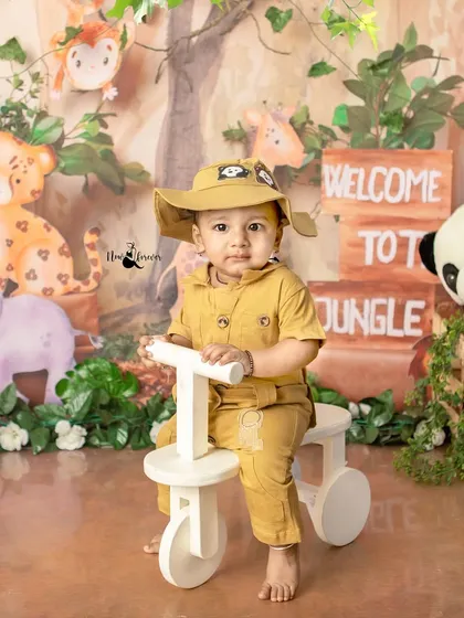 This little adventurer is exploring the jungle on his bike. The detailed backdrop and props create an immersive and fun experience.
