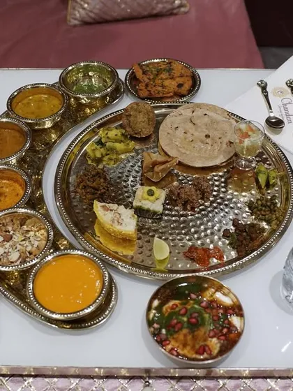 A feast for the eyes and the soul. This is our traditional Rajasthani thali, a complete culinary journey served with authentic flair and premium silver-plated tableware.