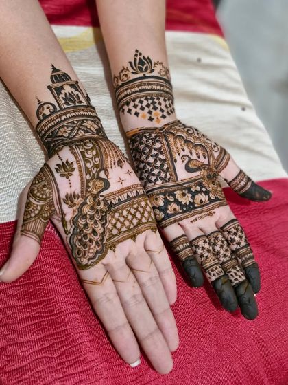 A custom design with peacocks and palace architecture. This is a popular choice for brides who want a royal and traditional mehendi.