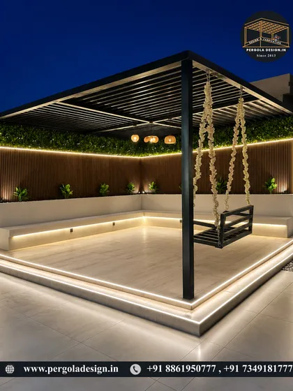 A stunning night view of a rooftop lounge. This pergola features a custom swing, built-in seating with under-glow lighting, and a vertical garden wall, all combining to create a high-end, resort-like feel.