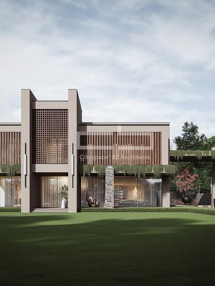 The facade of this home evokes contemporary minimalism with a beautiful play of volumes. Featuring wooden slats and jaali patterns, the design ensures optimal ventilation and a strong connection to nature, with green accents adding to the peaceful aesthetic.
