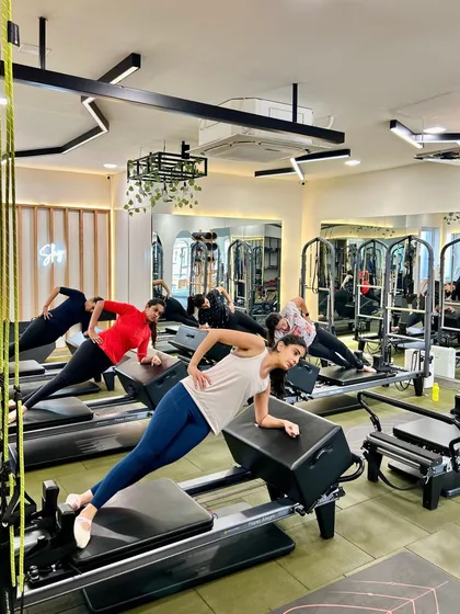 Flex, flow, and feel amazing. A side plank on the reformer box is a full-body exercise that especially targets the obliques.